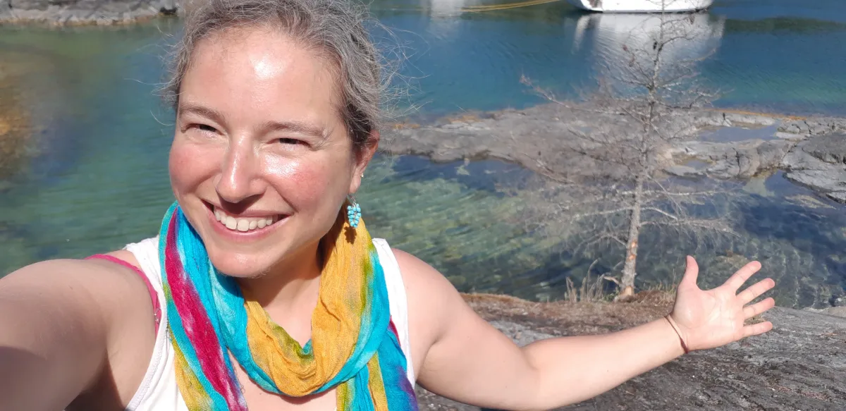 Enjoy a peaceful moment Marni Levitt smiling and enjoying a peaceful moment surrounded by nature.